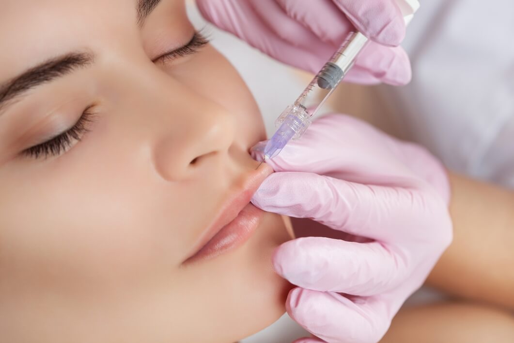 a woman receives a botox injection